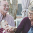 Old couple holding grandchildren